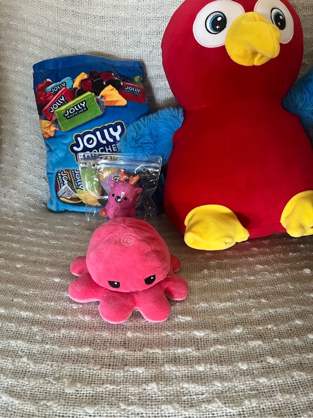 Lot of 4 kids toys. 2 plushies, I squishy and 1 flip octopus